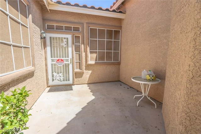 1174 Monogram Way, Las Vegas, NV 89123 - doorway to property with stucco siding and a patio