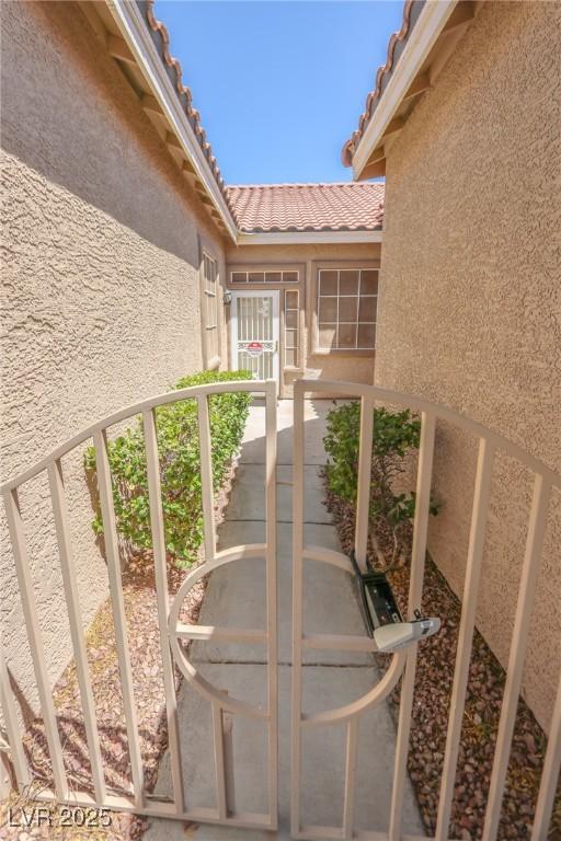 1174 Monogram Way, Las Vegas, NV 89123 - view of exterior entry featuring stucco siding and a tile roof