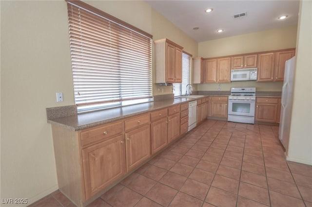1174 Monogram Way, Las Vegas, NV 89123 - kitchen with white appliances, light brown cabinets, light tile patterned floors, and recessed lighting