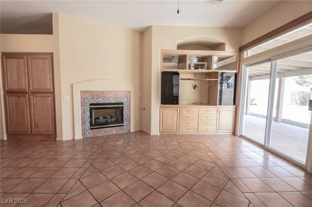 1174 Monogram Way, Las Vegas, NV 89123 - unfurnished living room featuring a fireplace and light tile patterned floors