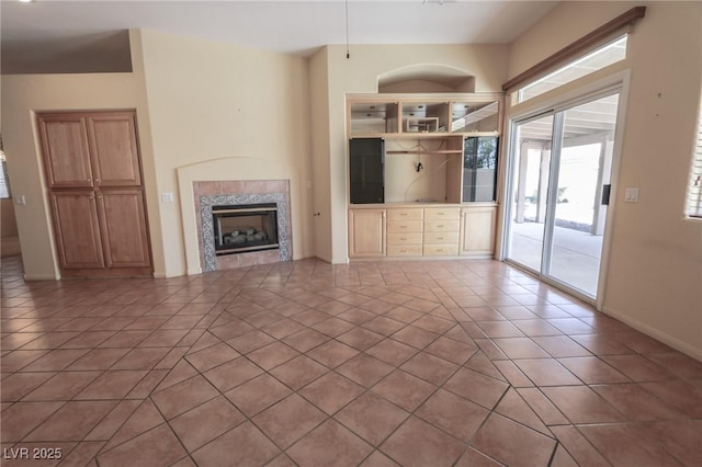 1174 Monogram Way, Las Vegas, NV 89123 - unfurnished living room with a fireplace and tile patterned flooring