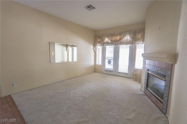 1174 Monogram Way, Las Vegas, NV 89123 - unfurnished living room with a tile fireplace and carpet