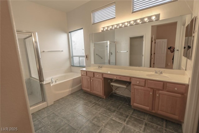 1174 Monogram Way, Las Vegas, NV 89123 - bathroom featuring a stall shower, double vanity, a bath, and tile patterned floors