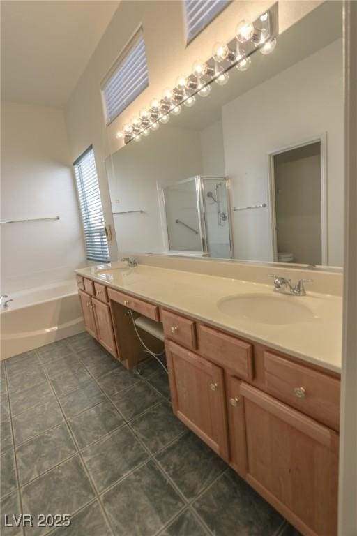 1174 Monogram Way, Las Vegas, NV 89123 - bathroom featuring double vanity, a stall shower, a bath, and tile patterned flooring
