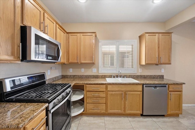 2117 Bay Thrush Way N, Las Vegas, NV 89084 - kitchen with appliances with stainless steel finishes, light brown cabinetry, and light tile patterned floors