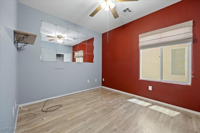 2117 Bay Thrush Way N, Las Vegas, NV 89084 - empty room featuring a ceiling fan and wood finished floors