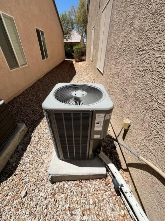 2117 Bay Thrush Way N, Las Vegas, NV 89084 - exterior view of a central air condition unit and stucco siding