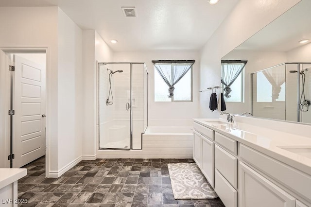 5606 Verde Valley Ct, North Las Vegas, NV 89081 - bathroom with a shower stall, a garden tub, double vanity, and recessed lighting