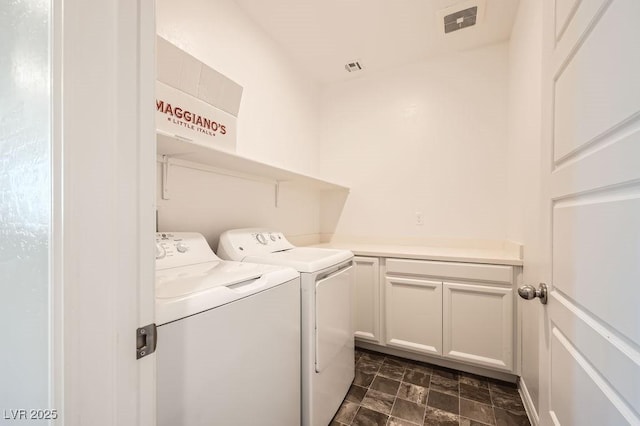 5606 Verde Valley Ct, North Las Vegas, NV 89081 - washroom featuring separate washer and dryer, stone finish flooring, and cabinet space