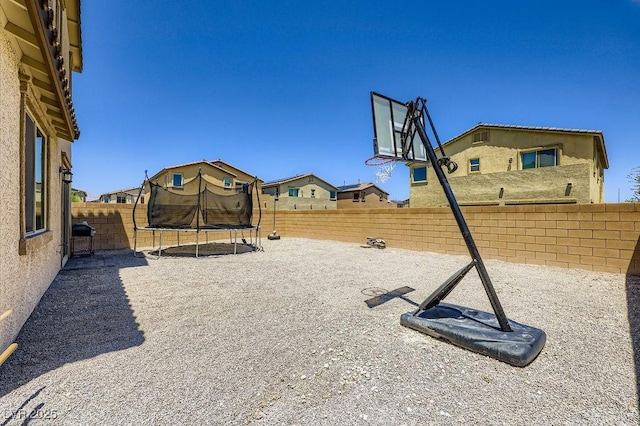 5606 Verde Valley Ct, North Las Vegas, NV 89081 - fenced backyard with a trampoline