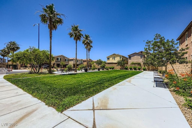 5606 Verde Valley Ct, North Las Vegas, NV 89081 - surrounding community with a residential view and a yard