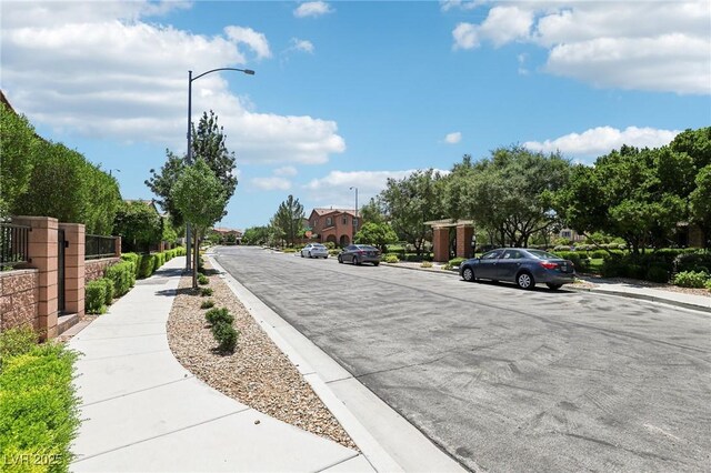 1922 Via Delle Arti, Henderson, NV 89044 - view of asphalt road with sidewalks, curbs, and street lighting