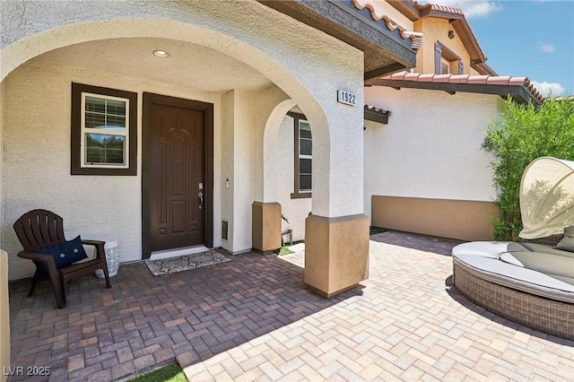 1922 Via Delle Arti, Henderson, NV 89044 - entrance to property with stucco siding, a tiled roof, and a patio area
