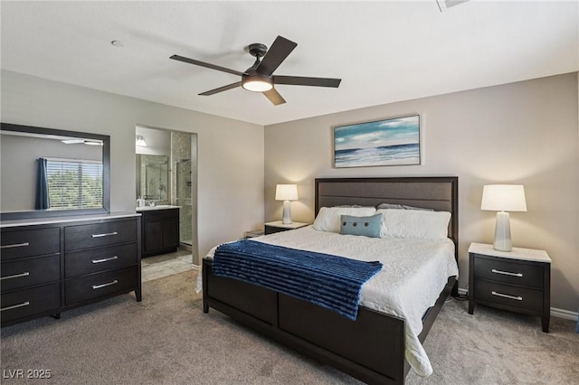 1922 Via Delle Arti, Henderson, NV 89044 - bedroom featuring light colored carpet, a ceiling fan, and connected bathroom