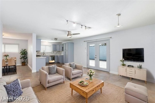 1700 Ivanhoe Way, Las Vegas, NV 89102 - living room with french doors, light tile patterned floors, a ceiling fan, and track lighting