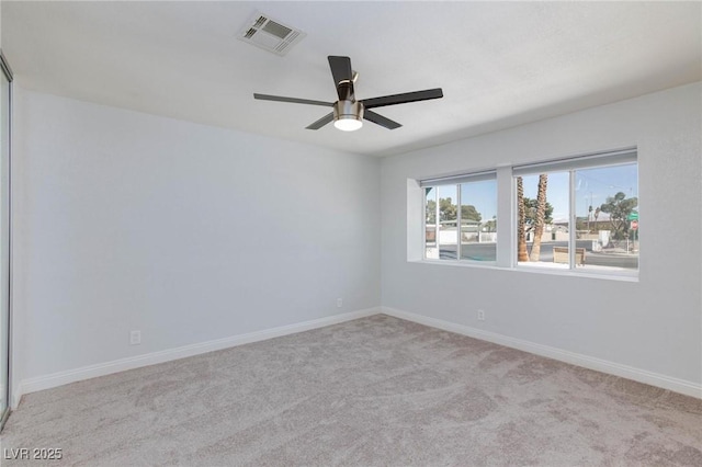 1700 Ivanhoe Way, Las Vegas, NV 89102 - empty room with light colored carpet and a ceiling fan