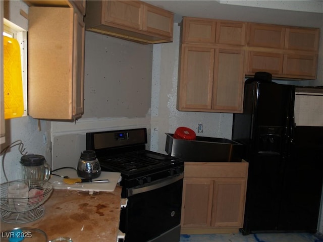 5068 Killarney St, Las Vegas, NV 89122 - kitchen featuring black appliances, light brown cabinets, and light countertops