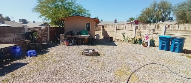 5068 Killarney St, Las Vegas, NV 89122 - fenced backyard with a fire pit