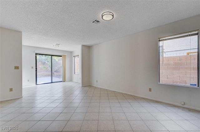8809 Beach Front Dr, Las Vegas, NV 89117 - empty room featuring a textured ceiling and light tile patterned floors
