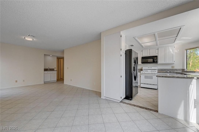 8809 Beach Front Dr, Las Vegas, NV 89117 - kitchen with black appliances, white cabinetry, light tile patterned floors, a textured ceiling, and open floor plan
