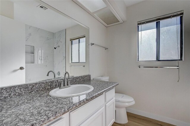 8809 Beach Front Dr, Las Vegas, NV 89117 - bathroom with vanity, wood finished floors, and a shower