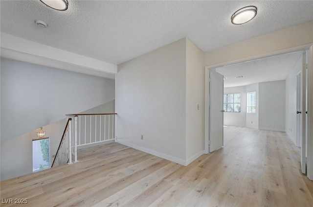 8809 Beach Front Dr, Las Vegas, NV 89117 - empty room featuring a textured ceiling, wood finished floors, and a smoke detector