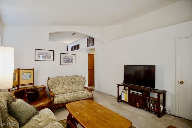6131 Pumpkin Patch Ave, Las Vegas, NV 89142 - living area with light carpet and arched walkways