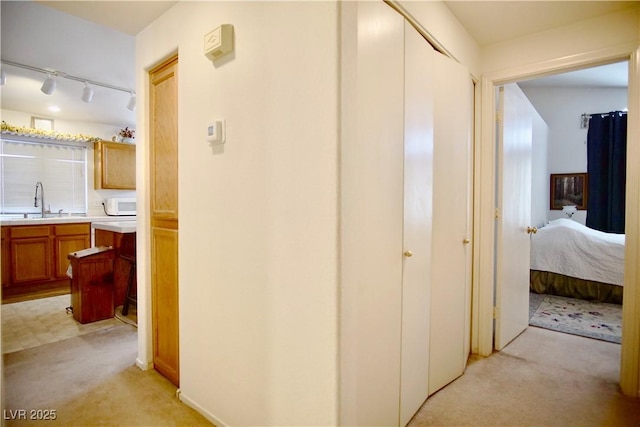6131 Pumpkin Patch Ave, Las Vegas, NV 89142 - corridor with light colored carpet and rail lighting