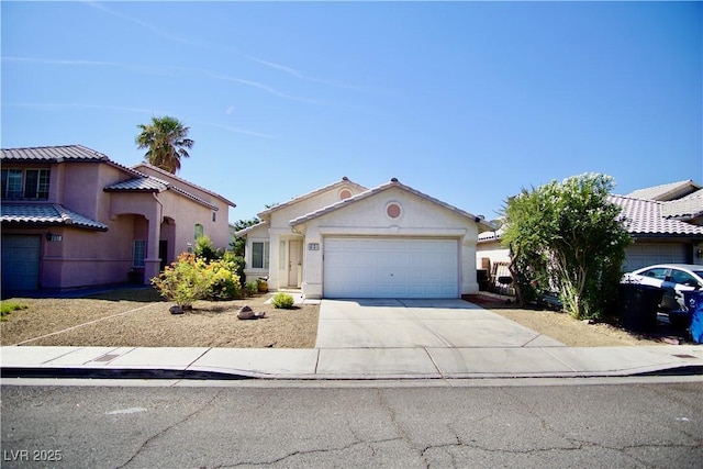6131 Pumpkin Patch Ave, Las Vegas, NV 89142 - mediterranean / spanish home featuring an attached garage, driveway, and stucco siding