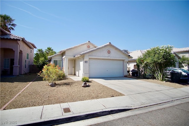 6131 Pumpkin Patch Ave, Las Vegas, NV 89142 - view of front of property with an attached garage, concrete driveway, and stucco siding