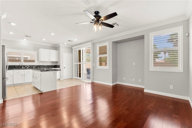 11649 Royal Derwent Dr, Las Vegas, NV 89138 - unfurnished living room with ceiling fan, light wood-style floors, crown molding, and recessed lighting