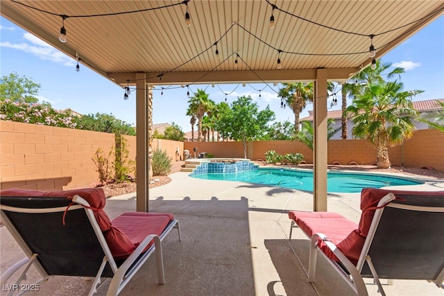 11649 Royal Derwent Dr, Las Vegas, NV 89138 - fenced backyard featuring a patio and a pool with connected hot tub