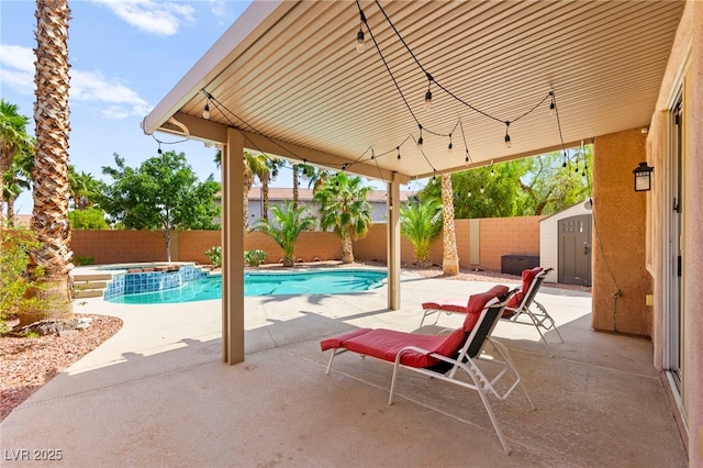 11649 Royal Derwent Dr, Las Vegas, NV 89138 - view of pool with a patio area, a fenced backyard, a shed, and a pool with connected hot tub
