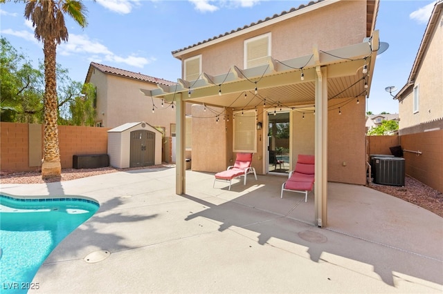 11649 Royal Derwent Dr, Las Vegas, NV 89138 - rear view of property with a patio, a shed, stucco siding, a fenced backyard, and a tiled roof