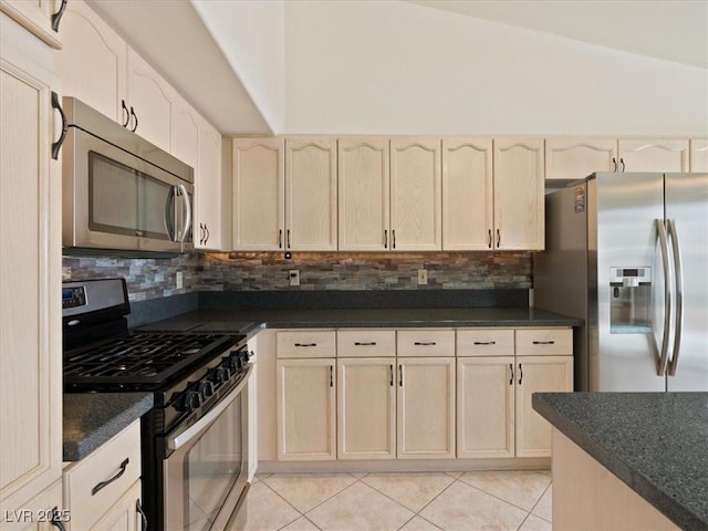 4323 Pageantry Falls Dr, North Las Vegas, NV 89031 - kitchen featuring stainless steel appliances, dark countertops, and decorative backsplash