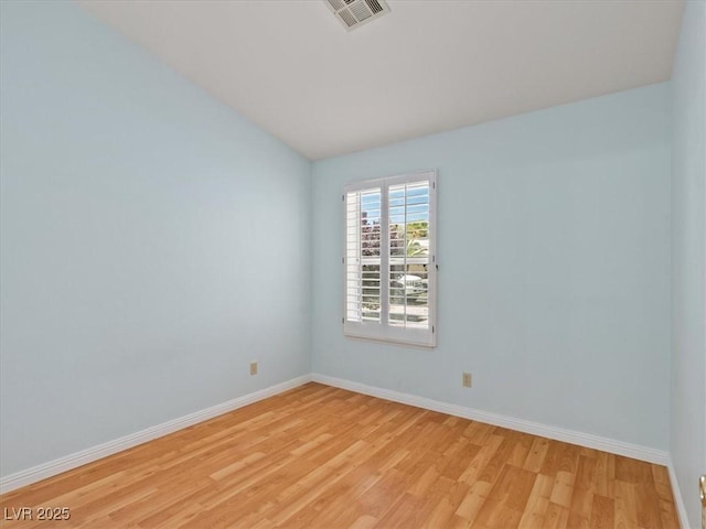 4323 Pageantry Falls Dr, North Las Vegas, NV 89031 - spare room with light wood-type flooring and lofted ceiling