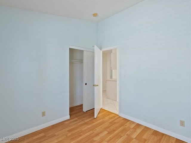 4323 Pageantry Falls Dr, North Las Vegas, NV 89031 - unfurnished bedroom with light wood finished floors and a closet