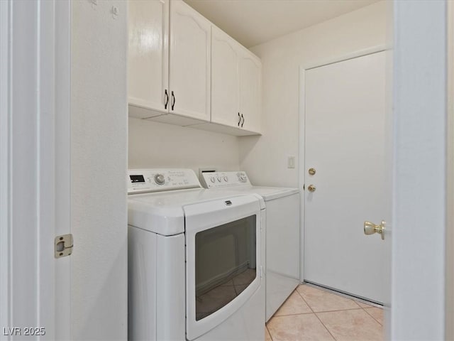 4323 Pageantry Falls Dr, North Las Vegas, NV 89031 - laundry room with washer and clothes dryer, cabinet space, and light tile patterned flooring