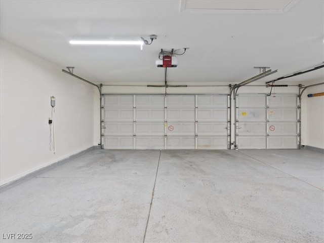 4323 Pageantry Falls Dr, North Las Vegas, NV 89031 - garage featuring a garage door opener and baseboards