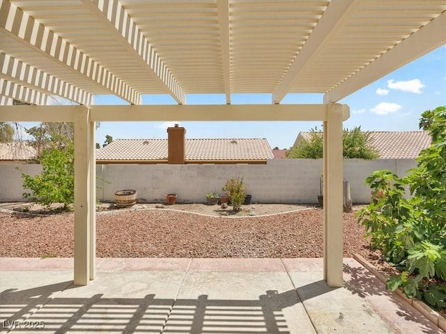 4323 Pageantry Falls Dr, North Las Vegas, NV 89031 - fenced backyard with a patio and a pergola