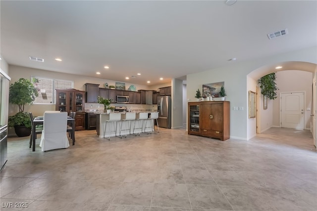 151 Duckhook Ave, Las Vegas, NV 89148 - living room with arched walkways, recessed lighting, and light tile patterned floors