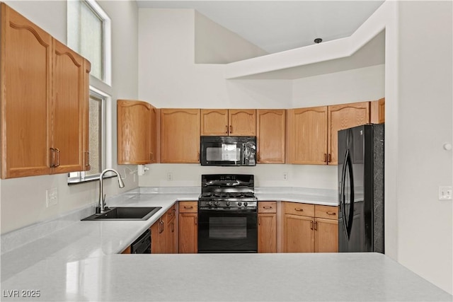 7825 White Grass Ave, Las Vegas, NV 89131 - kitchen with black appliances and light countertops