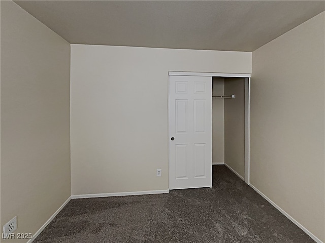 2132 Tierra Del Verde St, Las Vegas, NV 89156 - unfurnished bedroom featuring dark colored carpet and a closet