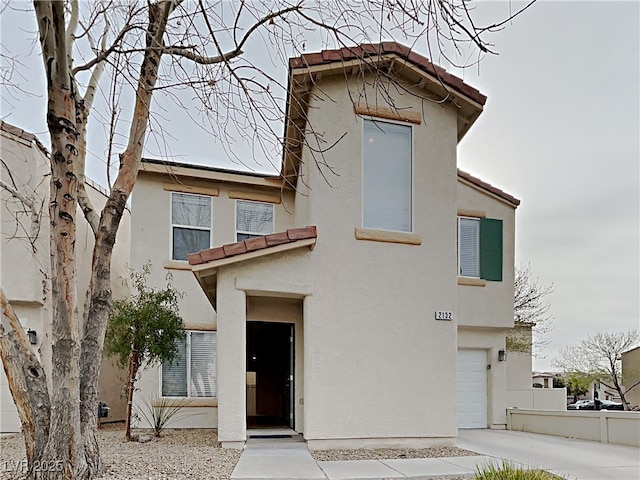 2132 Tierra Del Verde St, Las Vegas, NV 89156 - view of front facade featuring a tile roof, stucco siding, and a garage