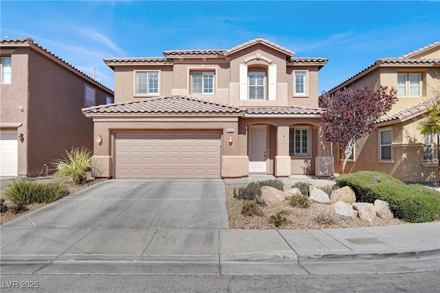 4036 W Bird Man Ln, North Las Vegas, NV 89084 - mediterranean / spanish-style house featuring stucco siding, driveway, a tiled roof, and a garage