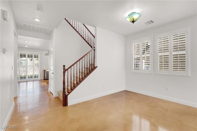 4036 W Bird Man Ln, North Las Vegas, NV 89084 - foyer entrance with stairs and finished concrete floors