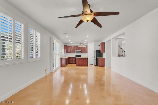 4036 W Bird Man Ln, North Las Vegas, NV 89084 - unfurnished living room with ceiling fan, finished concrete flooring, and recessed lighting