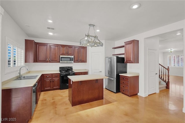 4036 W Bird Man Ln, North Las Vegas, NV 89084 - kitchen with appliances with stainless steel finishes, a kitchen island, light countertops, recessed lighting, and finished concrete floors