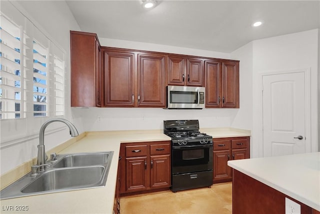 4036 W Bird Man Ln, North Las Vegas, NV 89084 - kitchen featuring gas stove, stainless steel microwave, light countertops, and recessed lighting