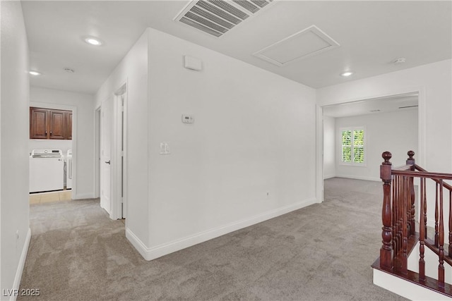 4036 W Bird Man Ln, North Las Vegas, NV 89084 - hallway with light colored carpet, separate washer and dryer, recessed lighting, and an upstairs landing